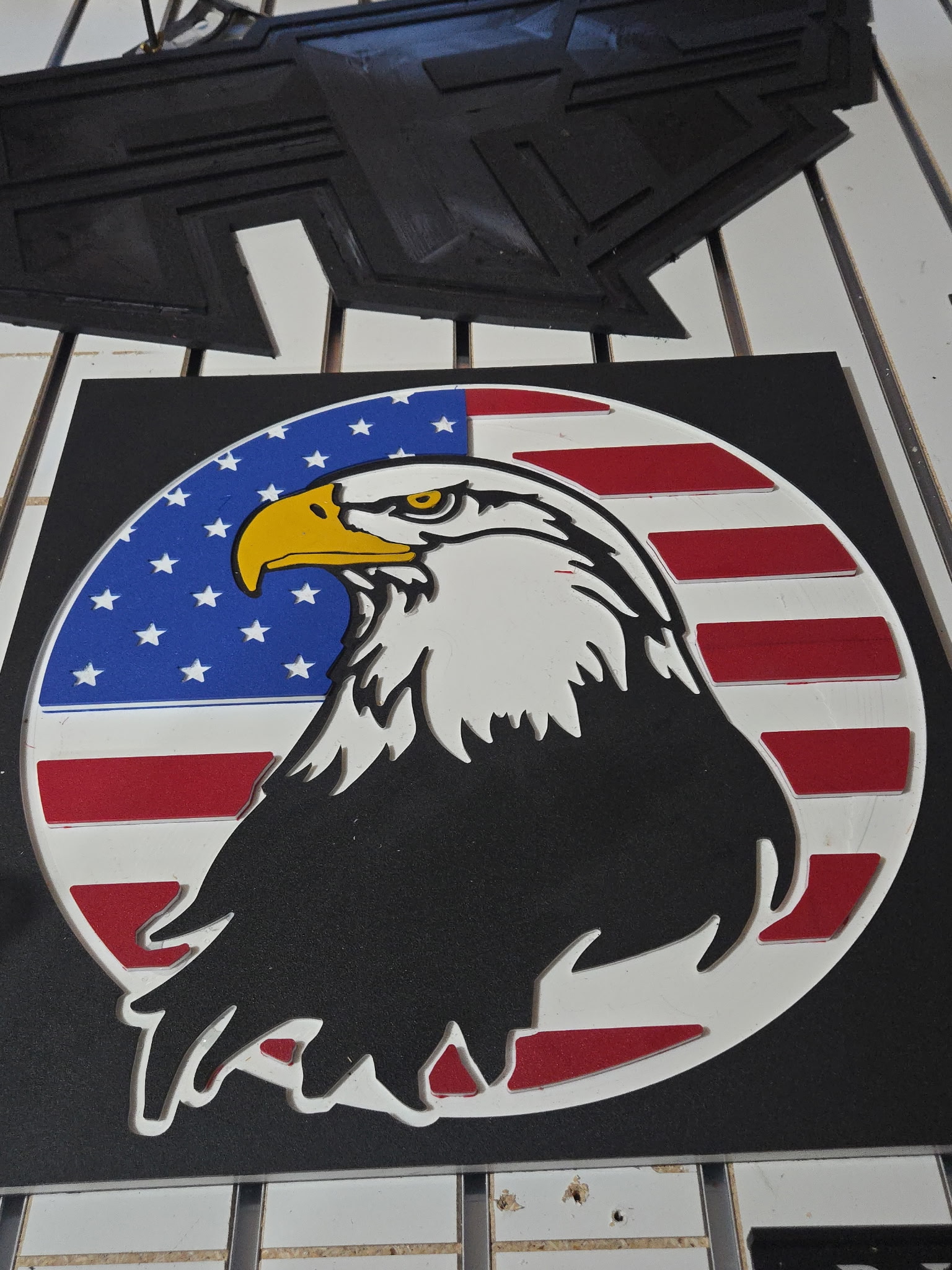 American flag with carved bald eagle sign