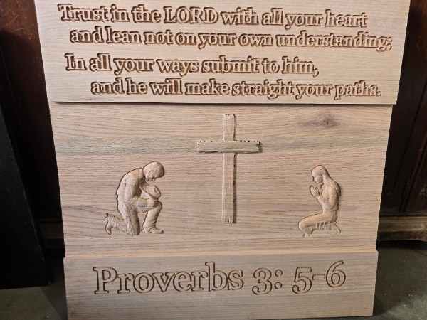 Wood plaque carved with Proverbs 3:5-6 and two praying figures